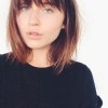 Medium length hair with bangs for round faces